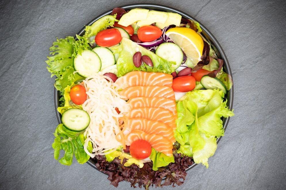 A delicious salad with salmon in the proper nutrition menu for weight loss